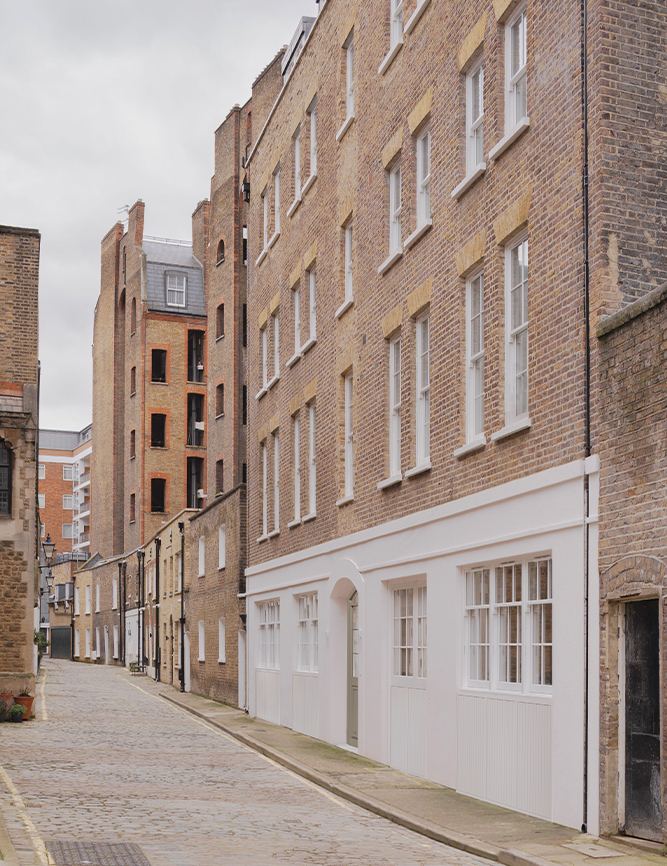 Outdoor shot of industrial facade in a cobblestone street.
